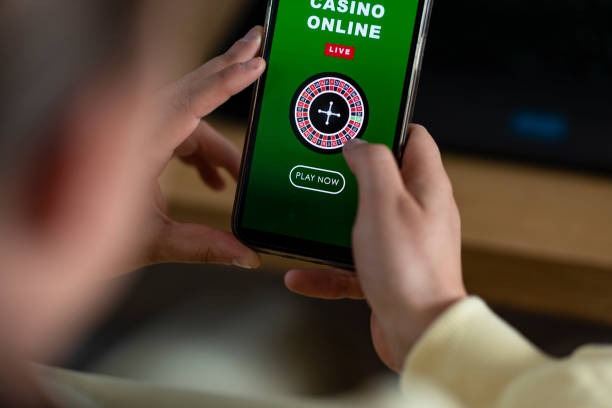 Live dealer roulette studio alongside slot game selection interface